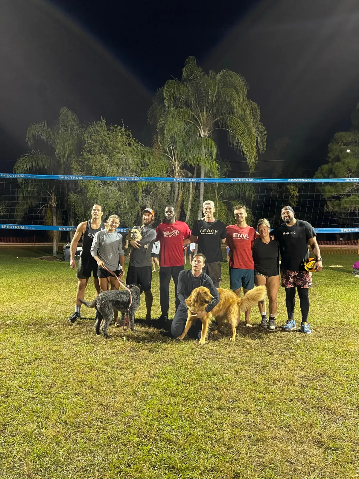 Tournament players and their dogs after a night match