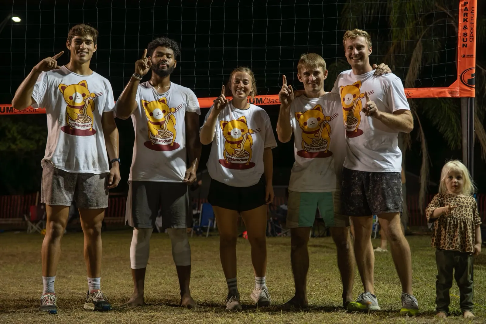 Winning team celebrating under the lights