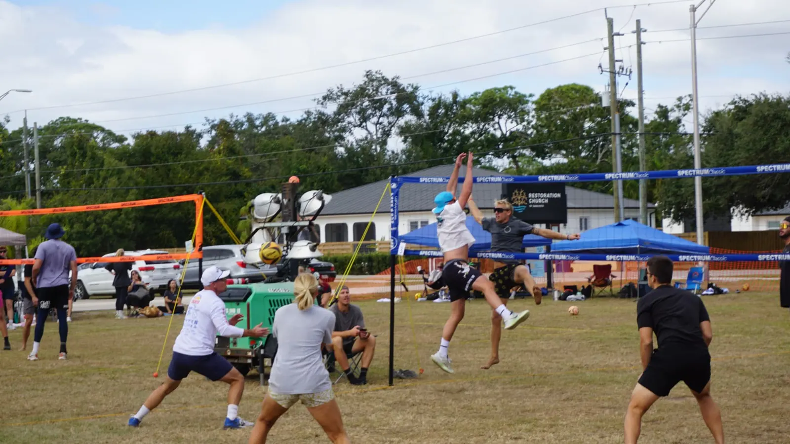 Two players go up together at the net as the defense waits